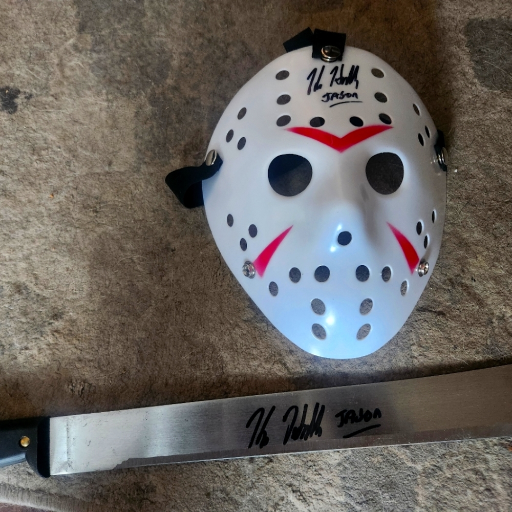 Kane Hodder signed Friday the 13th mask with signed machete.  COA Certified